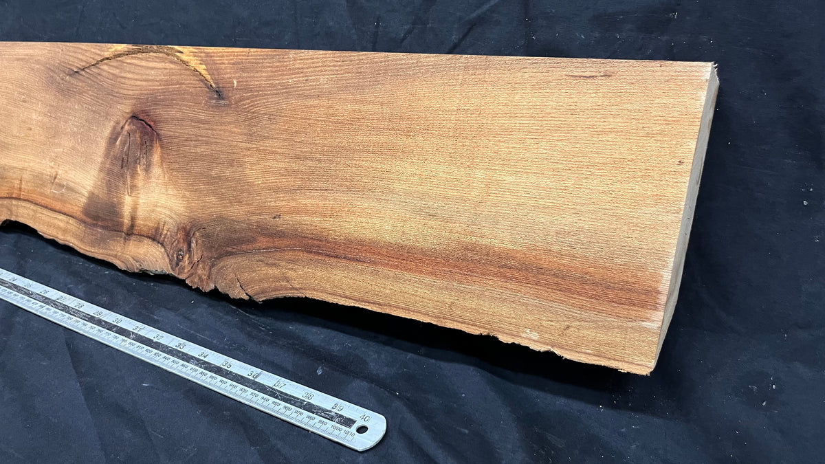 Elm mantle piece, natural edge 1228 L x 202 W x 58 D mm    (717)