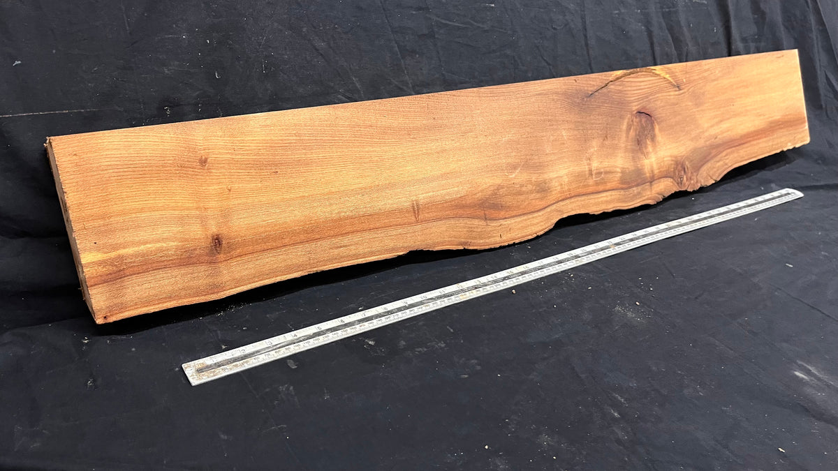 Elm mantle piece, natural edge 1228 L x 202 W x 58 D mm    (717)